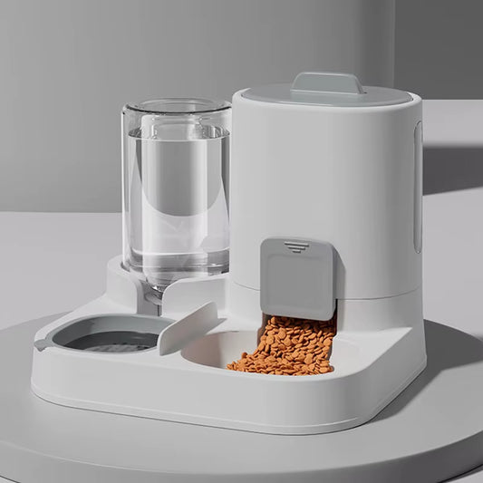 Automatic gravity pet feeder and water dispenser in gray on kitchen floor
